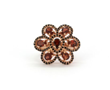 A 925 silver rose gold gilt ring set with garnets and black spinels, (O).