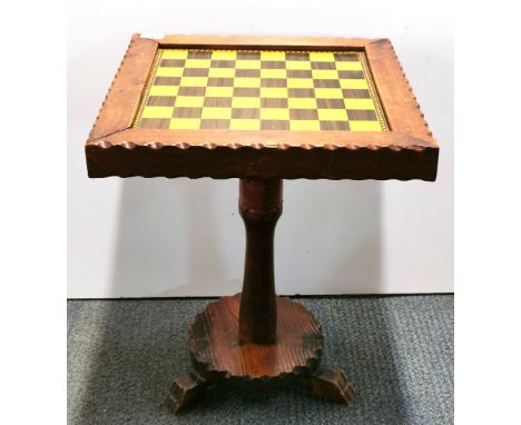 A pine pedestal chess table, 45 x 45 x 55cm.