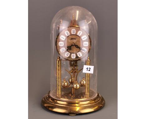 A Haller torsion clock under dome, H. 29cm.