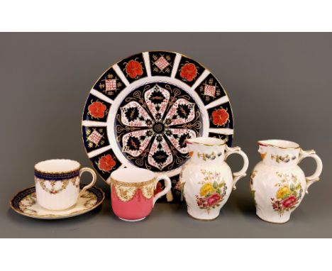 A pair of Royal Worcester cream jugs with a hand painted Derby style plate, a Royal Worcester coffee can and saucer and a fur