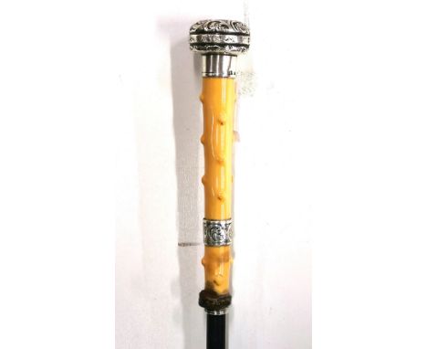 An antique hallmarked silver and ivory handled walking stick, L. 85cm.