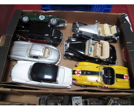 Seven Scale Diecast Model Cars by Burago, Solido, Maisto, predominantly 1:18th scale, including Burago 1:18th Scale Ferrari 2