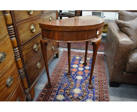 A mahogany demi-lune fold over card table.