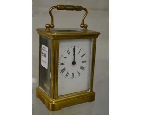 A brass carriage clock.