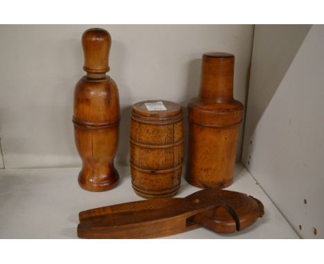 Four items of treen to include a nut cracker.