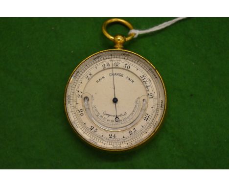 A pocket combination barometer and thermometer.