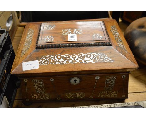 A Victorian mother of pearl inlaid rosewood sarcophagus shaped work box.