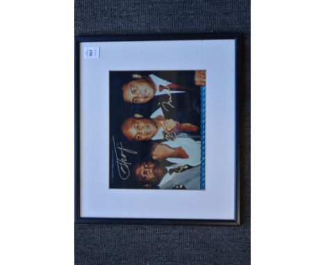 Boxing interest, a colour photographic print signed by Muhammad Ali, Joe Frazier and George Foreman.