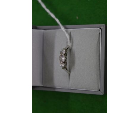 An 18ct gold and diamond three stone ring.