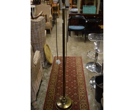 A brass standard lamp.