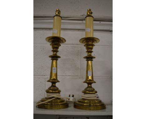 A pair of heavy brass lamp bases.
