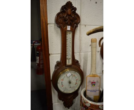 An oak cased barometer and thermometer (dial cracked).