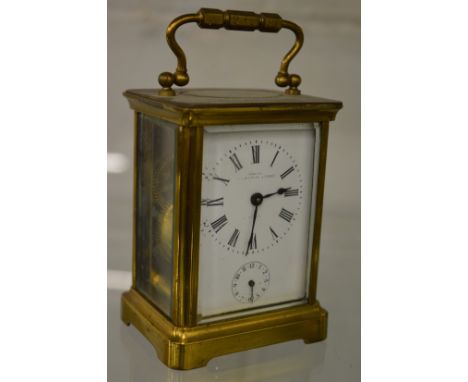 A brass carriage clock with alarm.