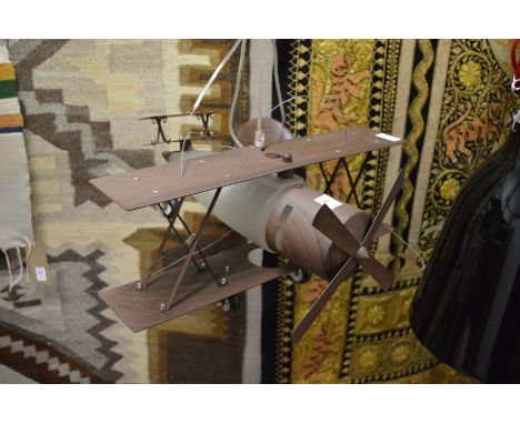 An unusual ceiling light fitting modelled as a biplane.