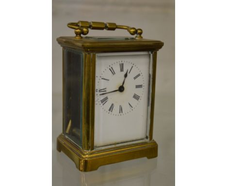 A brass carriage clock.