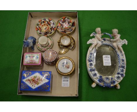 Porcelain collectables to include a miniature strut mirror, miniature cups and saucers etc.