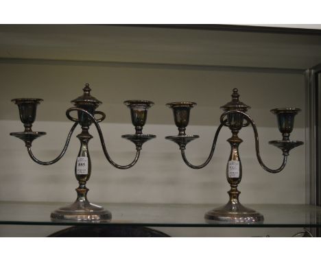 A pair of plated two branch three light candelabra.
