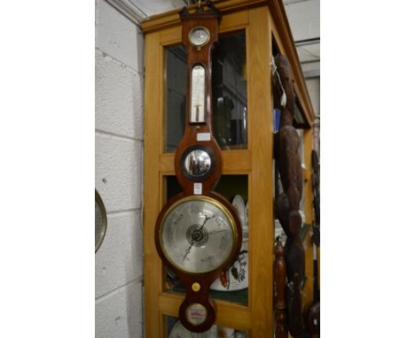 A mahogany cased barometer and thermometer.