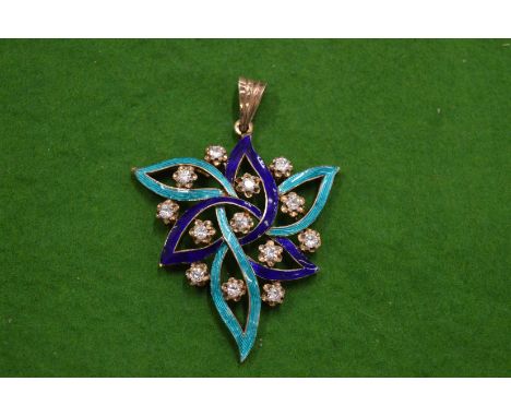 A decorative silver and enamel pendant.