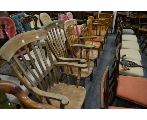 Three Windsor armchairs and a pair of similar stick back chairs.