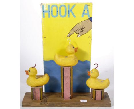 Hook A Duck - A vintage mid 20th Century fairground / funfair hand painted wooden sign for Hook A Duck with a row a plastic d