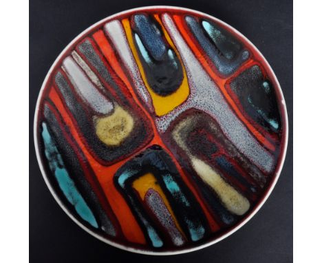 Poole Pottery - Delphis Range - A retro mid 20th Century&nbsp;ceramic studio art pottery plate / dish having a deep red groun