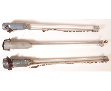 A selection of three large 20th Century retro vintage Industrial explosion proof suspension tube strip lights. Each having a 