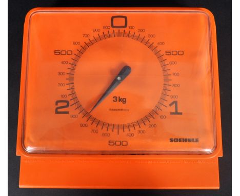 Soehnle mid-century (circa 1960-70) wall-mounted kitchen scale in the colour orange. The scale can weigh up to 3 kgs and the 