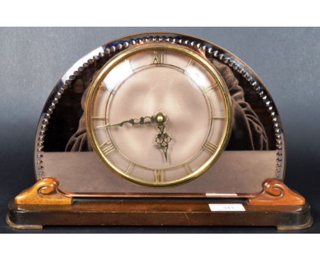 A vintage 20th Century Art Deco Smiths Sectric mantel clock having pink glass mirrored domed surround with etched border and 