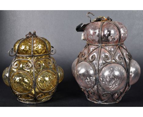 Two retro vintage 20th Century Italian Seguso Murano studio art glass hanging cage lanterns one in amber and the the other pi