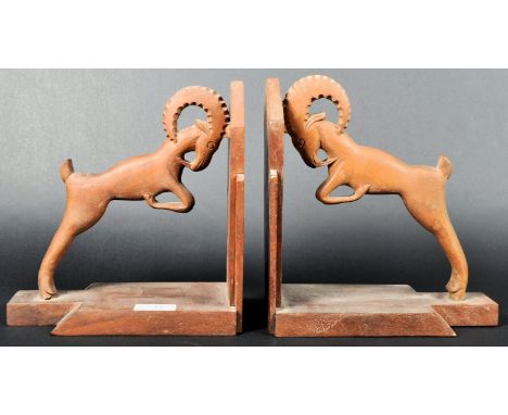 A matching pair of retro vintage 20th Century carved teak wood book ends of Art Deco influence with each having angled panels