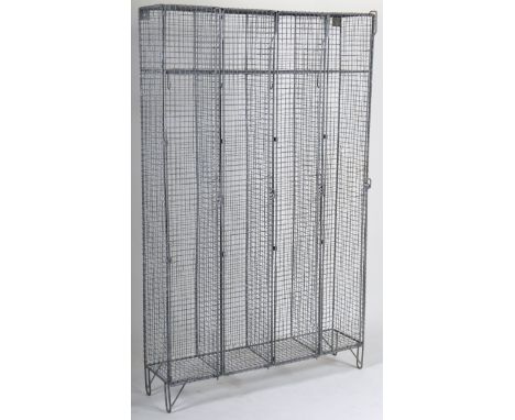 A retro vintage mid 20th Century industrial wire cage locker / cabinet comprising of four conjoined wire frame lockers with s