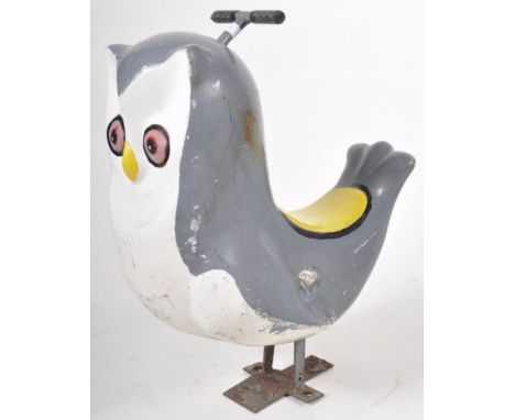 Juvenile owl carousel ride - A retro vintage mid 20th Century child's size fairground funfair amusement park attraction theme