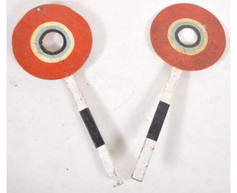 A pair of retro vintage mid 20th Century fairground funfair carousel amusement attraction shooting targets in the form of rai