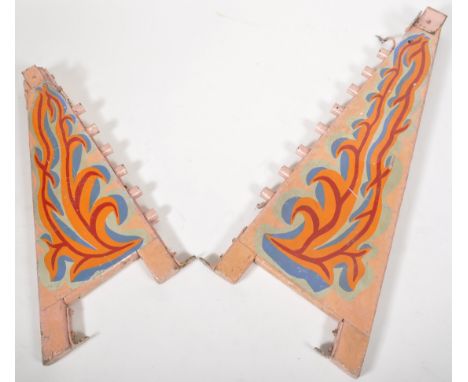 Two retro vintage mid 20th Century fairground / funfair amusement park angled panels having hand painted decoration on pink b