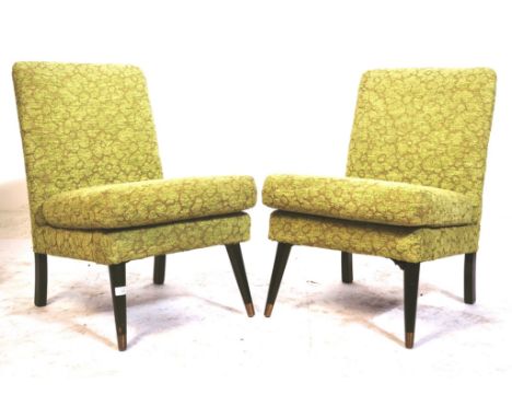 A matching pair of retro vintage mid 20th Century 1950's easy lounge chairs / bedroom chairs with each having padded and cush