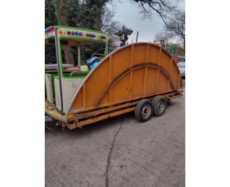 Fairground Carousel Ride - A large retro vintage 20th Century travelling folding funfair amusement carousel ride on trailer. 