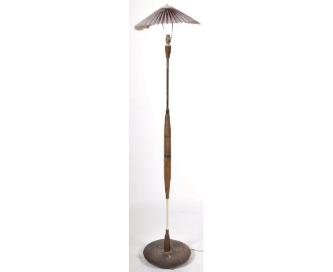 A retro vintage 1960's teak wood standard lamp light having an adjustable pleated parasol type shade over turned teak cylindr
