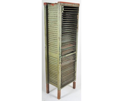 An retro vintage mid 20th Century industrial factory work tall metal printers cabinet. The cabinet / chest comprises a long b
