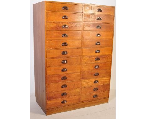 A large vintage early 20th Century golden oak upright pedestal haberdashery shop chest of drawers / museum specimen collector