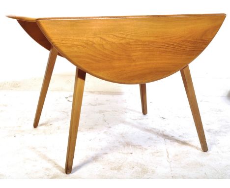 Lucian Ercolani - Ercol - Windsor Model 384 - A retro vintage 1960's beech and elm round circular drop leaf dining table havi