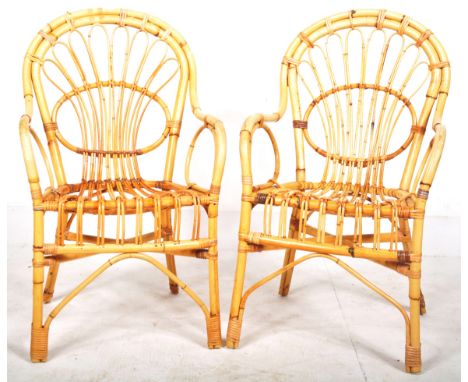 A matching pair of retro vintage mid 20th Century Italian bamboo and wicker / cane armchairs in the manner of Franco Albini. 