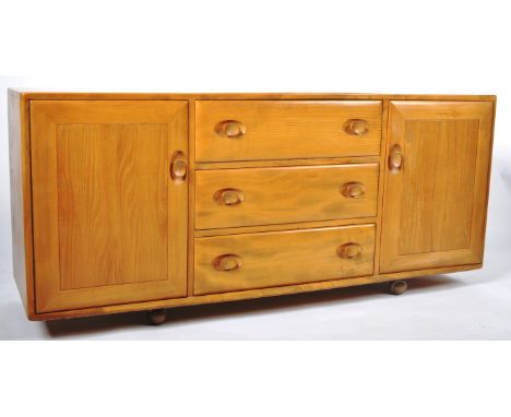Lucian Ercolani - Ercol - Windsor Range - A retro vintage 20th Century beech and elm sideboard credenza comprising of a centr