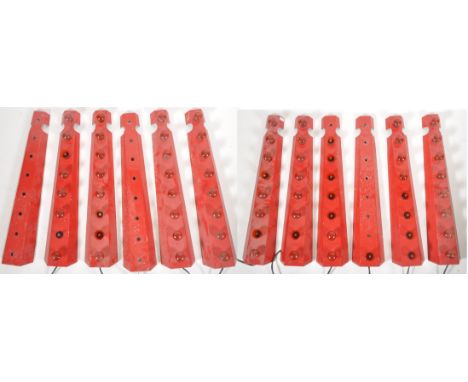 A set of twelve 20th Century fairground / funfair light strip panels of angled metal construction with each having a strip of