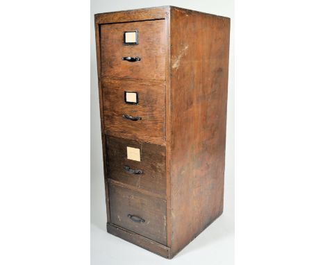 A vintage 20th Century Art Deco oak industrial upright pedestal filing cabinet chest having a graduating bank of three drawer
