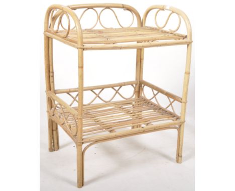 A retro vintage 20th Century 1970's two tier bamboo and wicker stand having raised back and side galleries with decorative sc