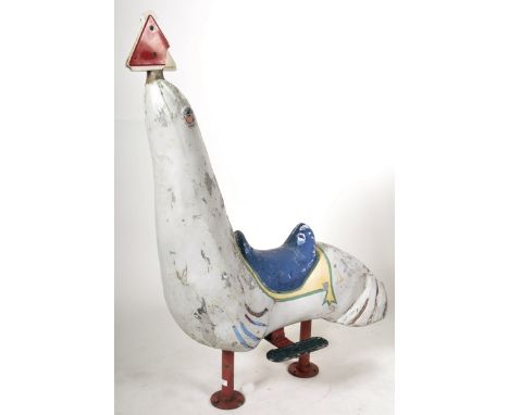 A retro vintage mid 20th Century fairground / funfair carousel ride of fiberglass construction modelled as a seal. The seal w