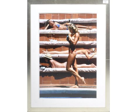 After&nbsp;Slim Aarons&nbsp;(American 1916-2006) - Catherine Wilke - A late 20th Century photo print depicting topless sunbat