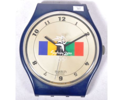 Swatch Maxi's&nbsp; - A large scale vintage 2000 Sydney Olympic Swiss Swatch wall hanging watch clock of plastic construction