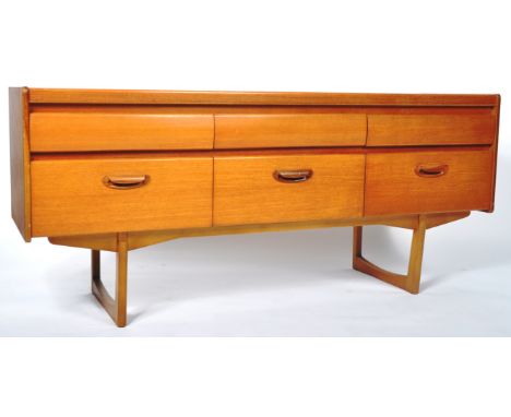 William Lawrence of Nottingham - A retro vintage 20th Century teak wood sideboard credenza having a run of three hidden drawe